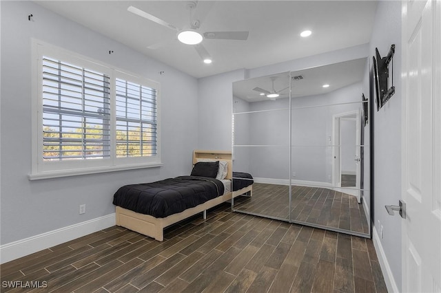 bedroom featuring dark hardwood / wood-style flooring and ceiling fan