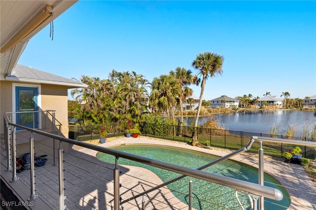 view of swimming pool with a water view