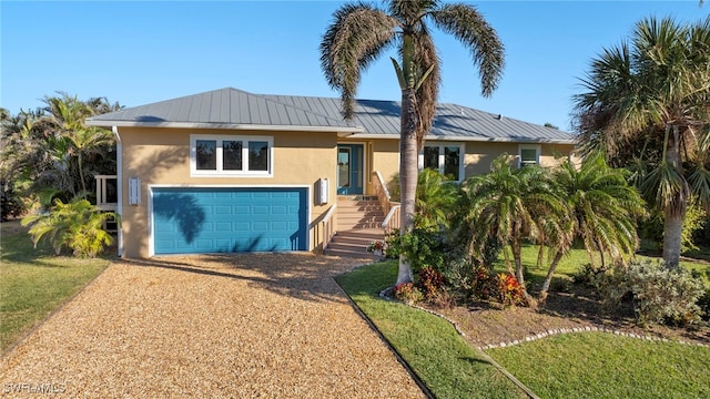 single story home featuring a garage