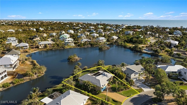 drone / aerial view with a water view