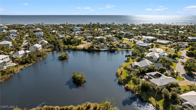 drone / aerial view with a water view