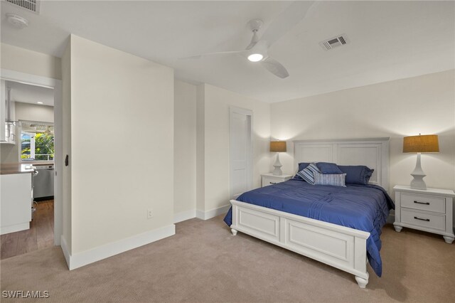 carpeted bedroom with ceiling fan