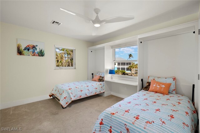 bedroom featuring ceiling fan and light colored carpet