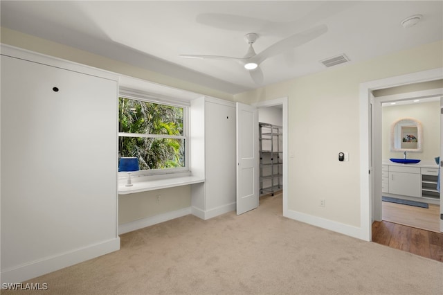 672 Durion Ct, Sanibel, FL 33957 - unfurnished bedroom with carpet floors, visible vents, built in desk, and baseboards