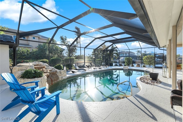 pool featuring a lanai and a patio area