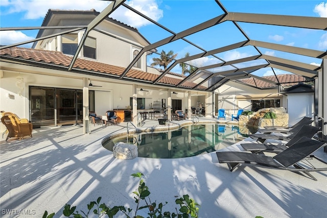 pool featuring a lanai, a patio area, ceiling fan, and exterior bar