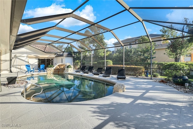 pool featuring a lanai and a patio area