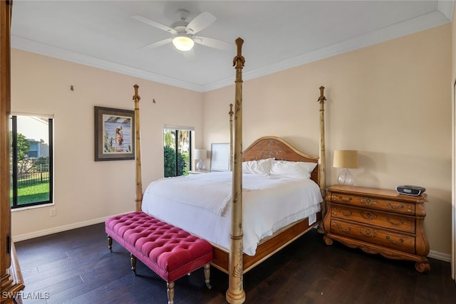 bedroom featuring ceiling fan, ornamental molding, dark wood-type flooring, and baseboards