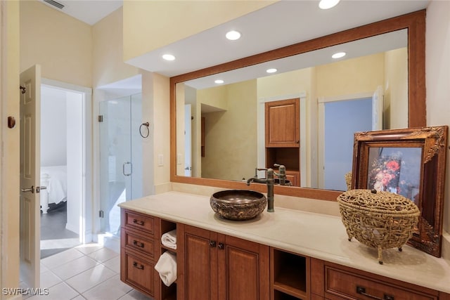 full bath with connected bathroom, tile patterned floors, vanity, a shower stall, and recessed lighting