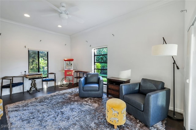 sitting room with a ceiling fan, recessed lighting, a healthy amount of sunlight, and crown molding