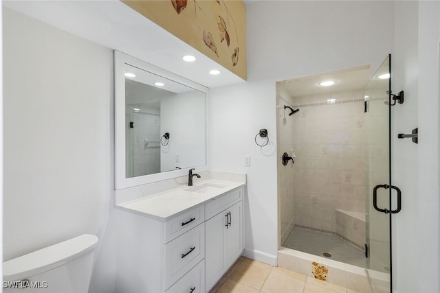 bathroom featuring recessed lighting, toilet, a stall shower, vanity, and tile patterned flooring