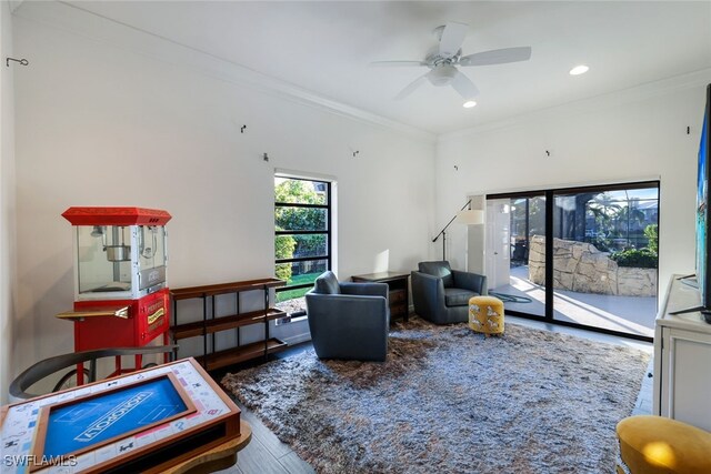 interior space with ornamental molding, recessed lighting, a ceiling fan, and wood finished floors