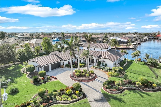 bird's eye view with a water view and a residential view