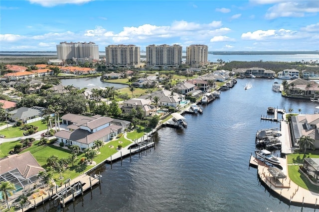 drone / aerial view featuring a water view and a residential view