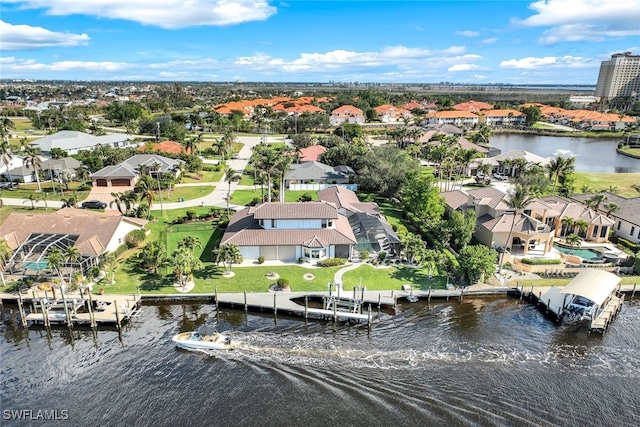 bird's eye view with a residential view and a water view