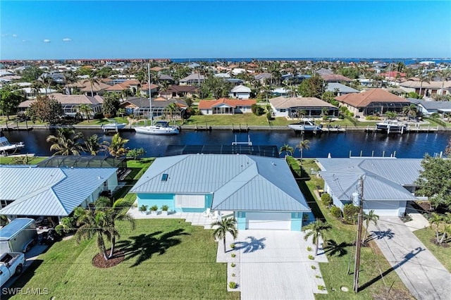 drone / aerial view with a water view