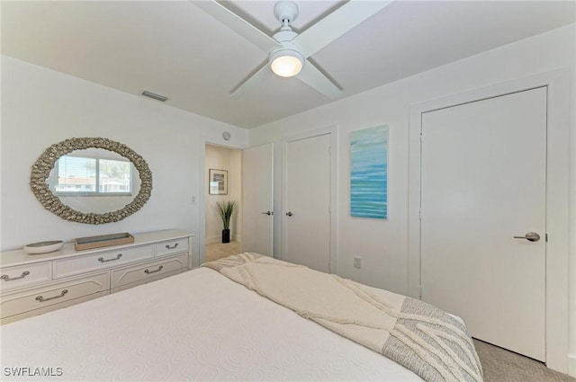 carpeted bedroom with ceiling fan