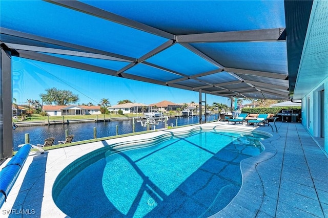 view of swimming pool featuring a water view and a dock