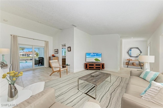 living room featuring a textured ceiling