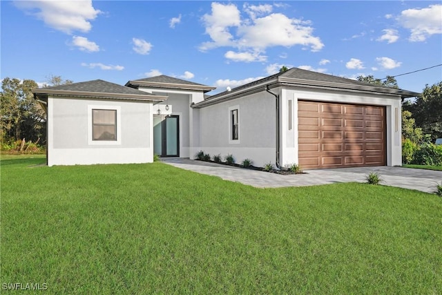 view of front of house with a garage and a front yard