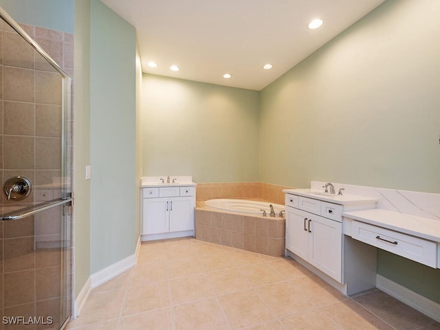 bathroom with tile patterned flooring, vanity, and independent shower and bath