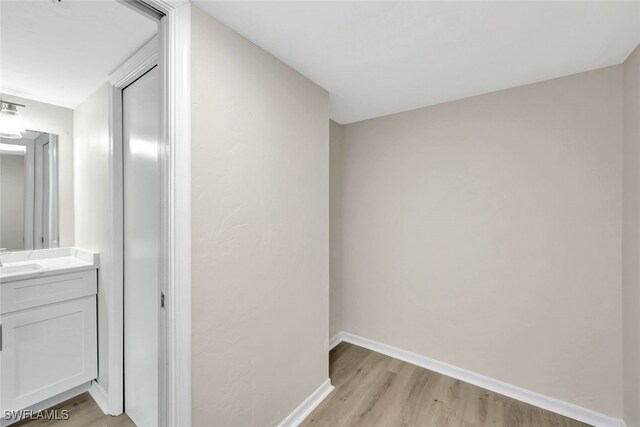 bathroom with vanity and hardwood / wood-style floors