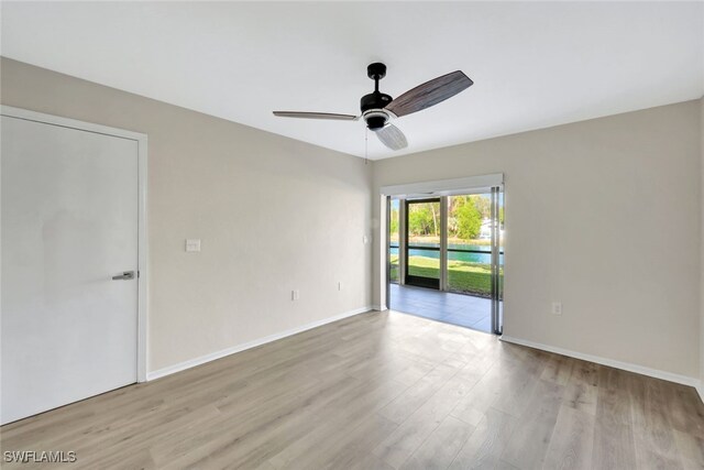 unfurnished room with ceiling fan and light hardwood / wood-style floors