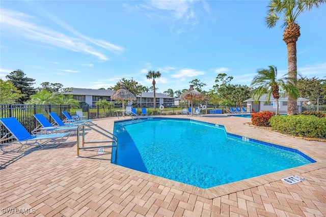 view of swimming pool with a patio area