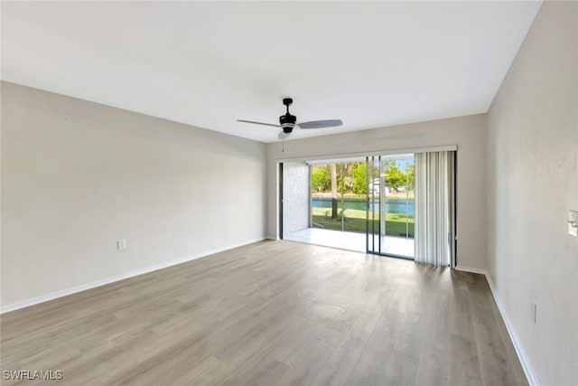 unfurnished room with ceiling fan and light hardwood / wood-style floors