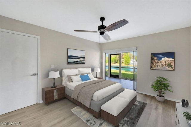 1227 Commonwealth Cir Unit G103, Naples, FL 34116 - bedroom featuring access to exterior, light wood-style flooring, ceiling fan, and baseboards