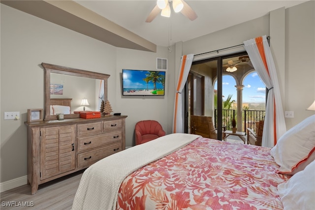 bedroom featuring a ceiling fan, visible vents, baseboards, light wood-style floors, and access to outside