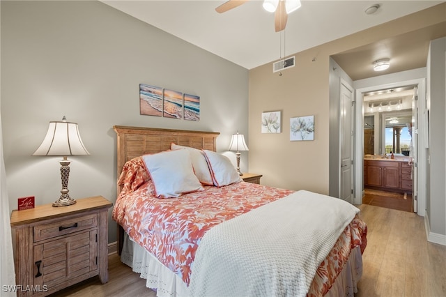 bedroom with light wood-type flooring, connected bathroom, and ceiling fan