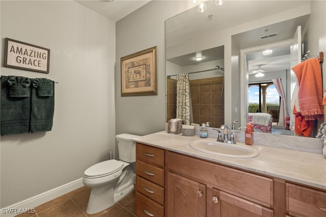 bathroom featuring tile patterned floors, walk in shower, vanity, ceiling fan, and toilet