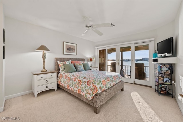 carpeted bedroom featuring ceiling fan, access to outside, and french doors