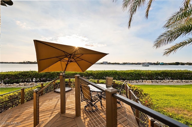 wooden deck featuring a water view