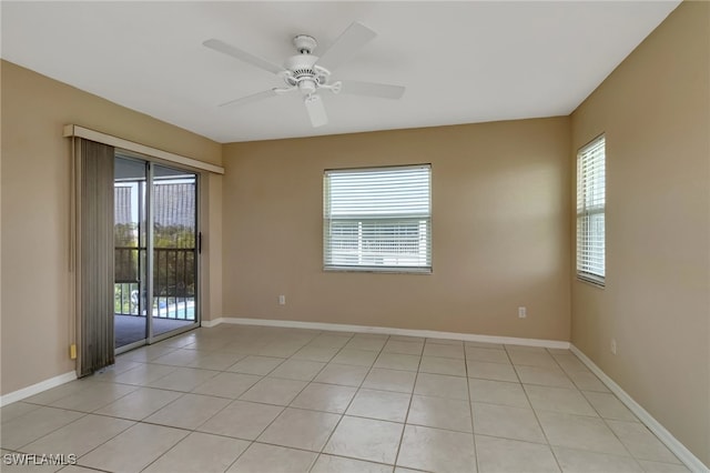 unfurnished room featuring ceiling fan and light tile patterned flooring