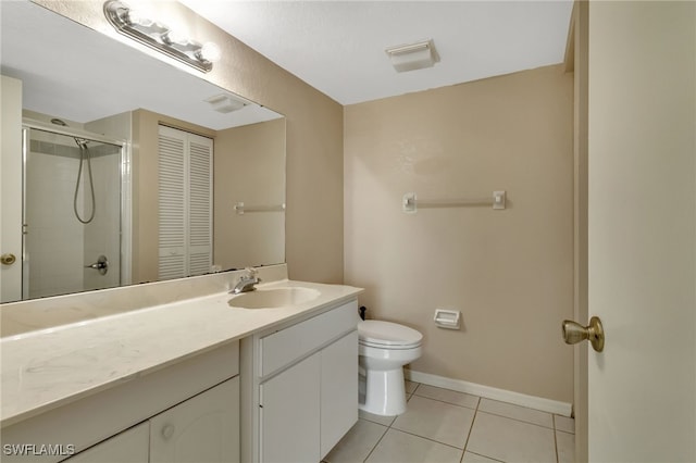 bathroom with a shower with shower door, tile patterned floors, vanity, and toilet