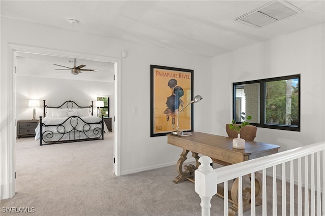 hallway with light colored carpet