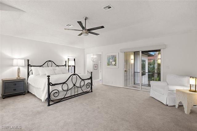 carpeted bedroom with ceiling fan with notable chandelier, a textured ceiling, and access to outside