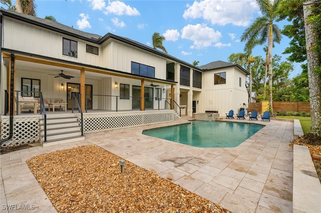 rear view of property with a patio, a fenced in pool, and ceiling fan