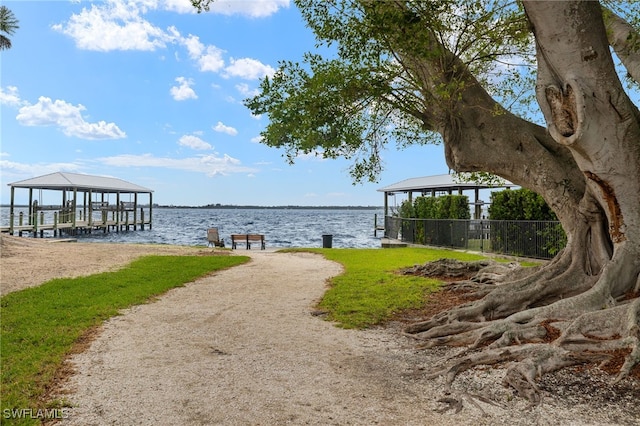 dock area featuring a gazebo and a water view