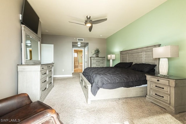 carpeted bedroom featuring ceiling fan and connected bathroom