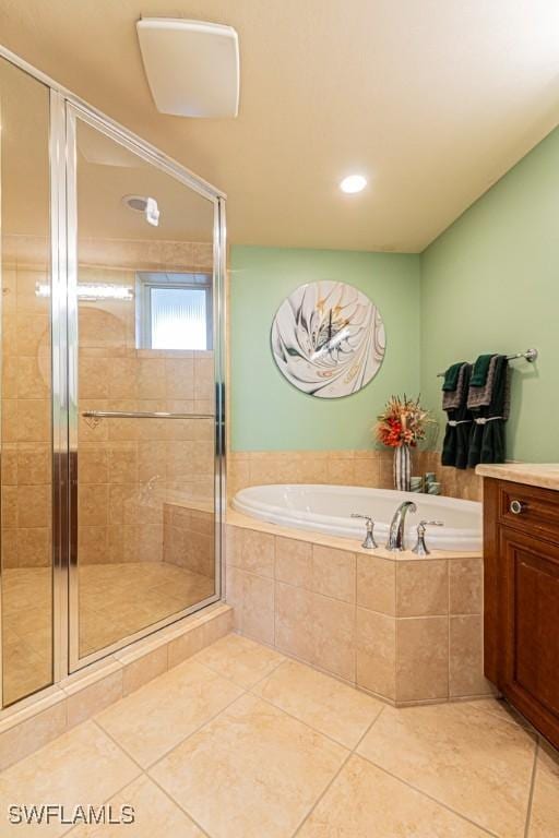 bathroom featuring tile patterned flooring, vanity, and independent shower and bath