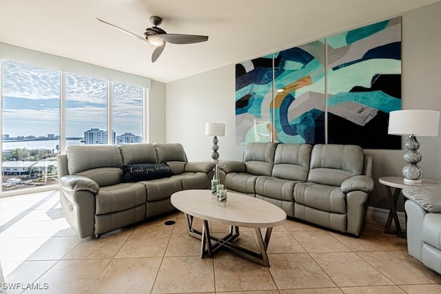 tiled living room with ceiling fan