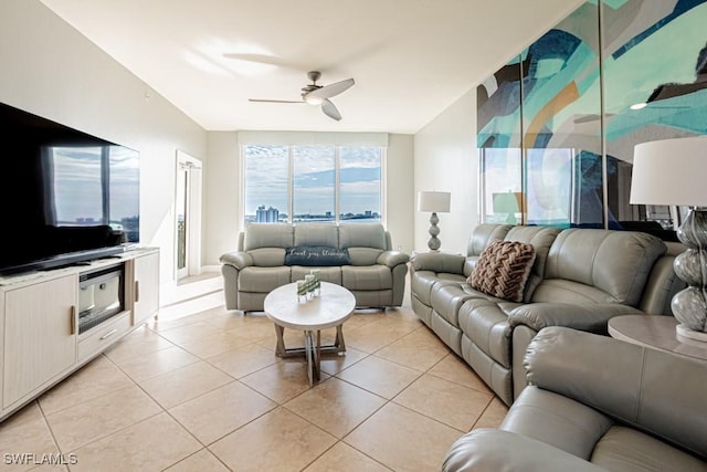 living room featuring ceiling fan and light tile patterned flooring