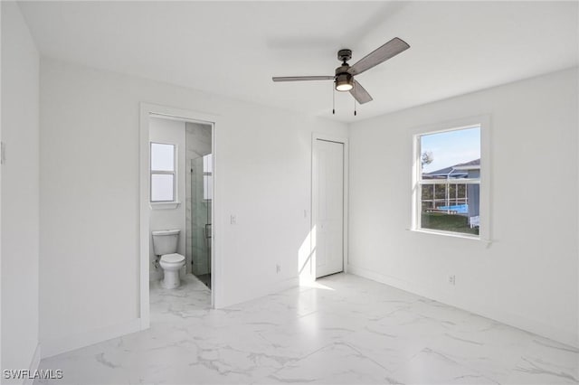 unfurnished bedroom with ensuite bathroom, a closet, and ceiling fan