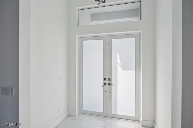 property entrance featuring french doors