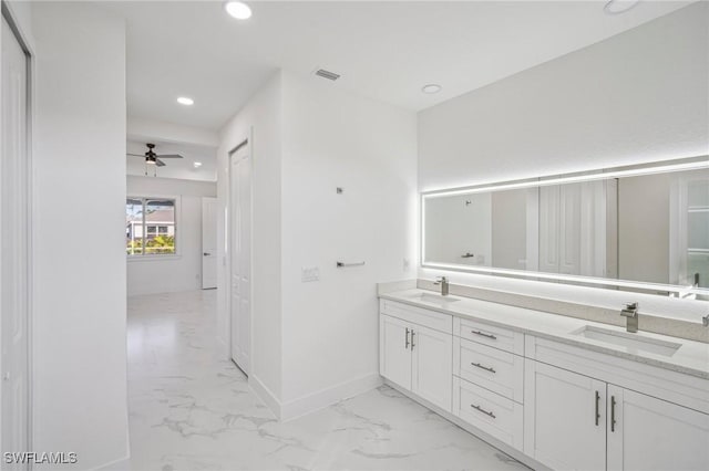 bathroom with ceiling fan and vanity