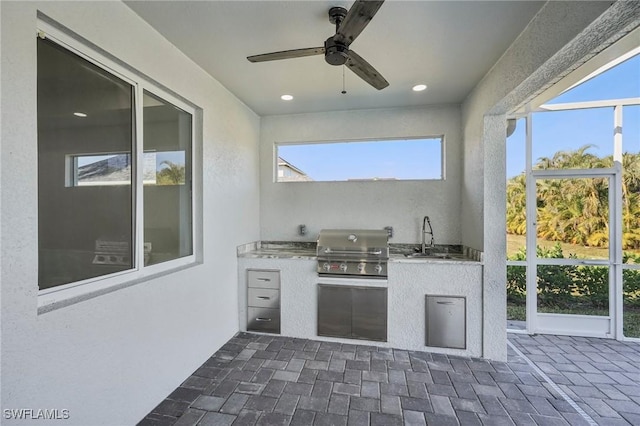 exterior space featuring ceiling fan and sink