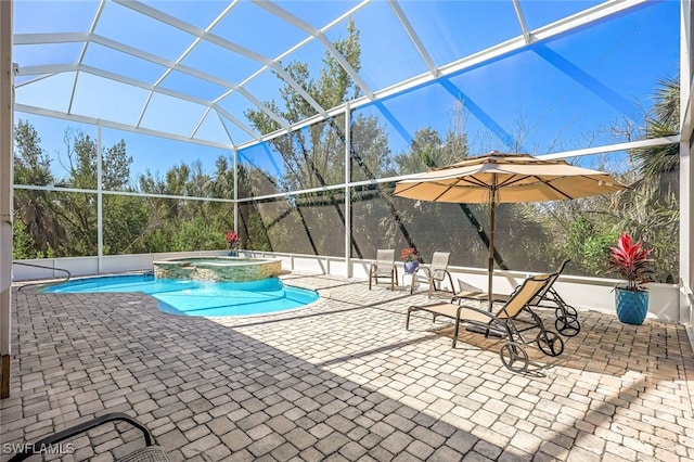 view of swimming pool featuring an in ground hot tub, a patio, and glass enclosure